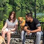 couple on bench with dog